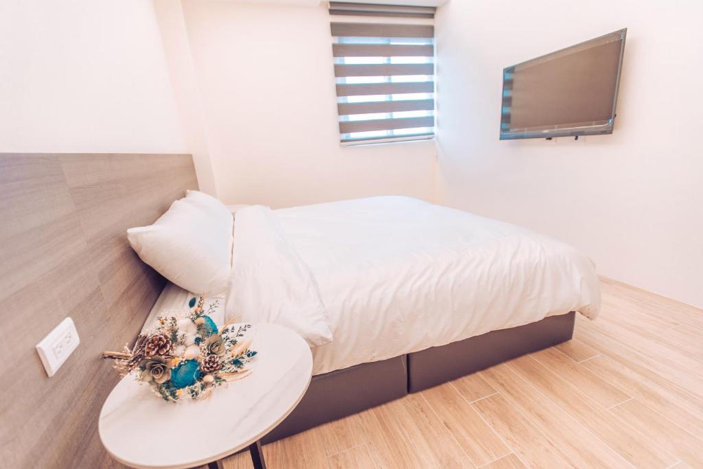 Postel nebo postele na pokoji v ubytování The Pai Hotel