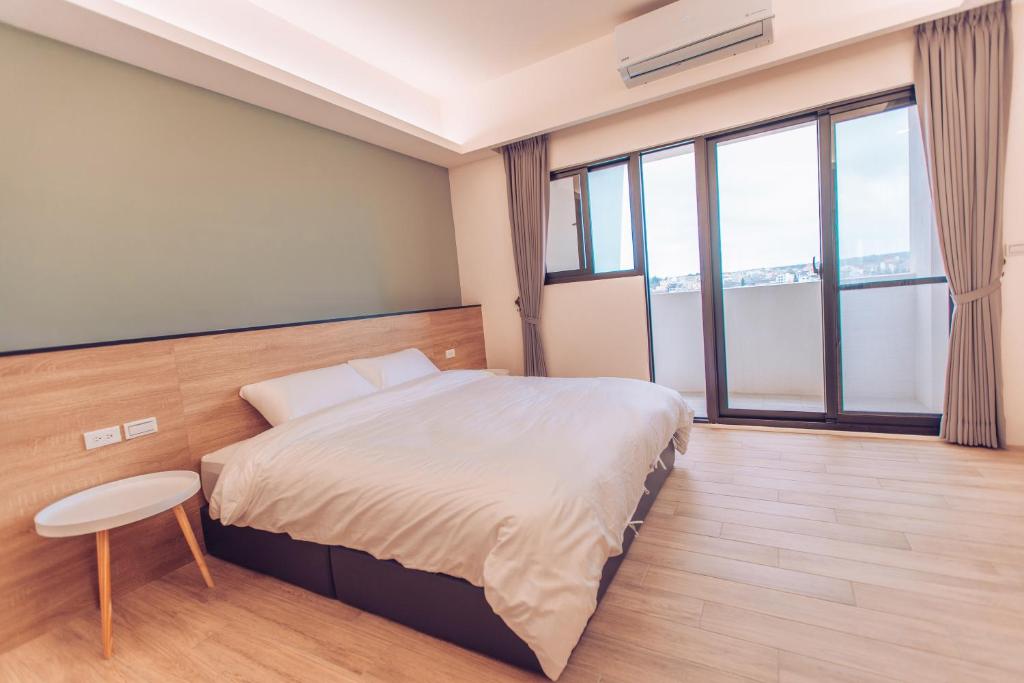 Postel nebo postele na pokoji v ubytování The Pai Hotel