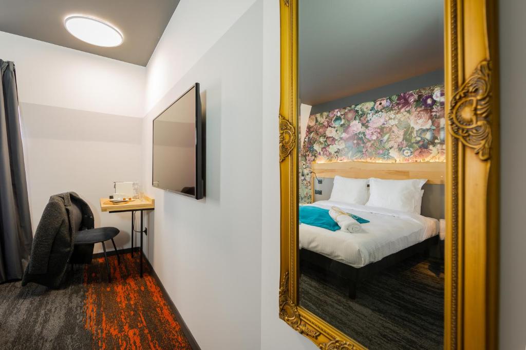 Postel nebo postele na pokoji v ubytování Berti Hotel - Mulhouse Centre Gare
