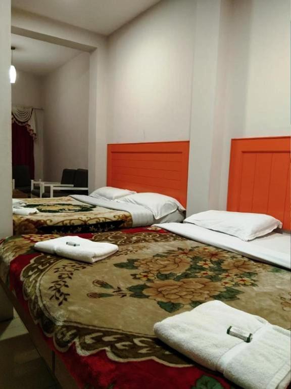 Postel nebo postele na pokoji v ubytování Hotel Preethi Palace