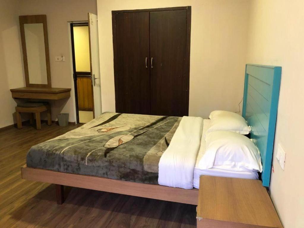Postel nebo postele na pokoji v ubytování Hotel Preethi Palace