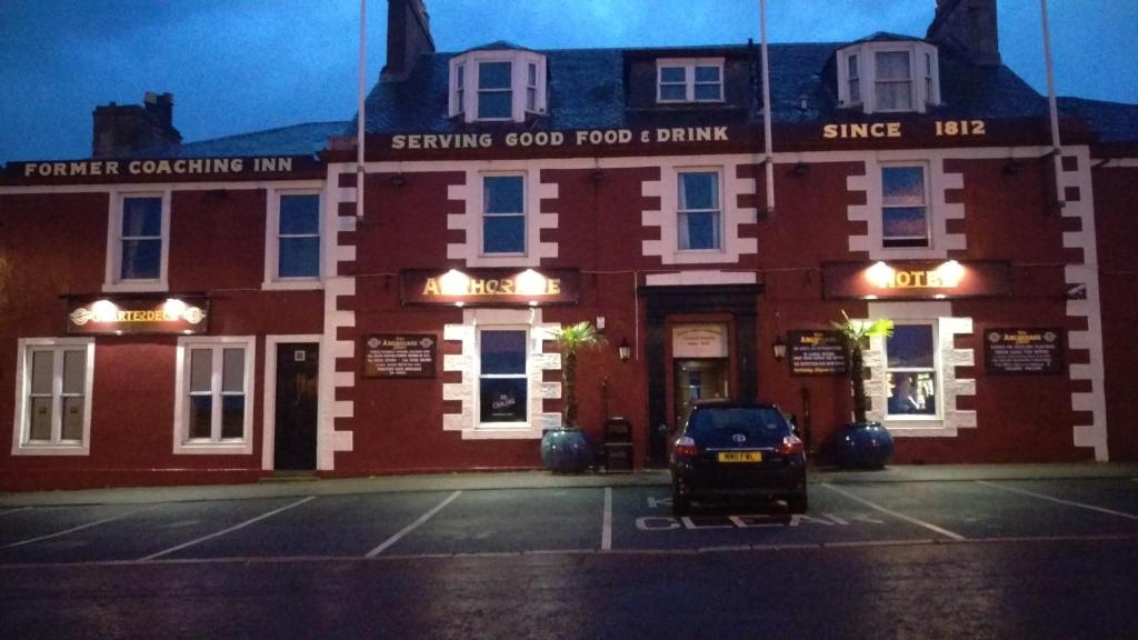 a building with a car parked in front of it at The Anchorage Hotel in Troon