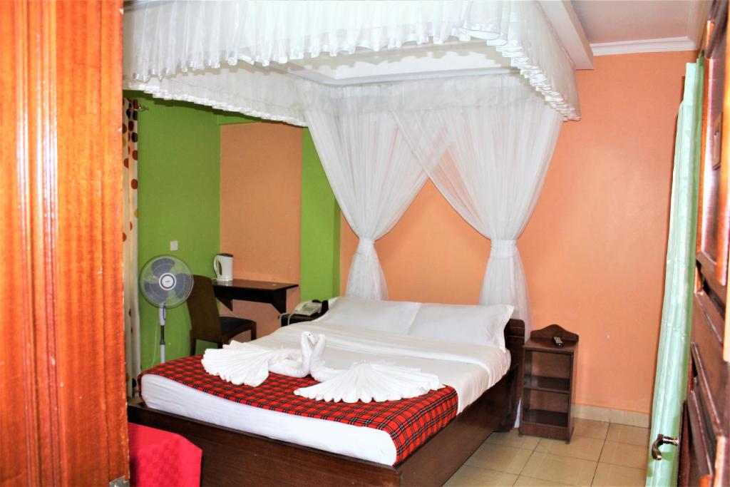 Postel nebo postele na pokoji v ubytování Hotel Kepler