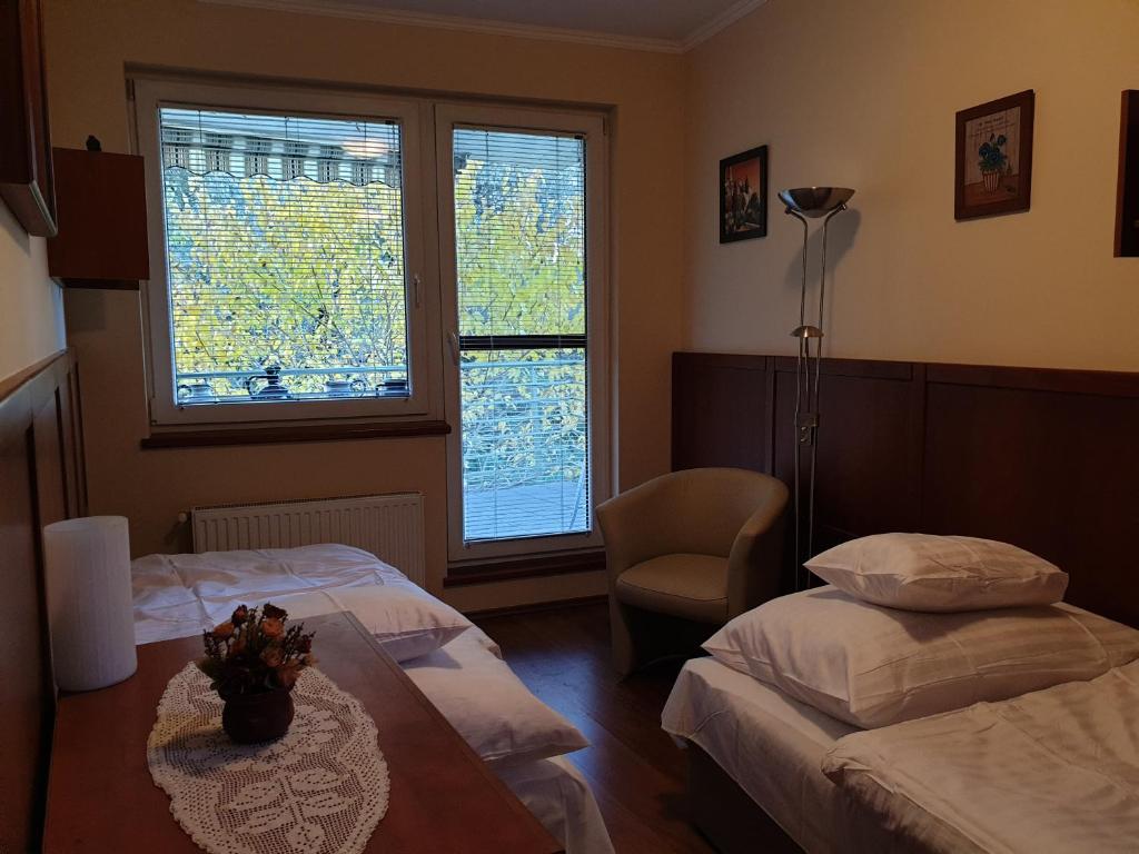 Postel nebo postele na pokoji v ubytování Beach Club Apartman
