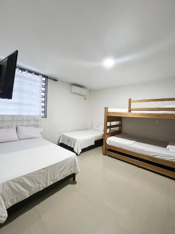 Postel nebo postele na pokoji v ubytování Hotel Acosta Castro