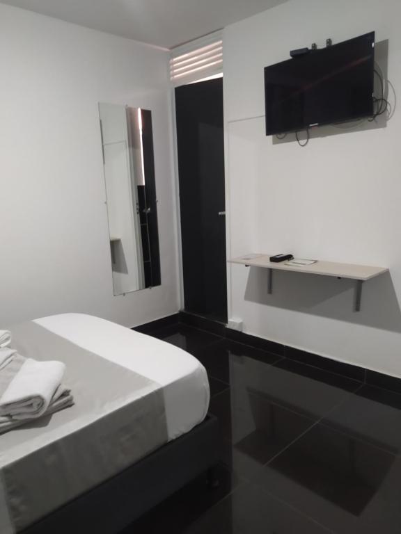 TV a/nebo společenská místnost v ubytování Hotel Aura Medellin
