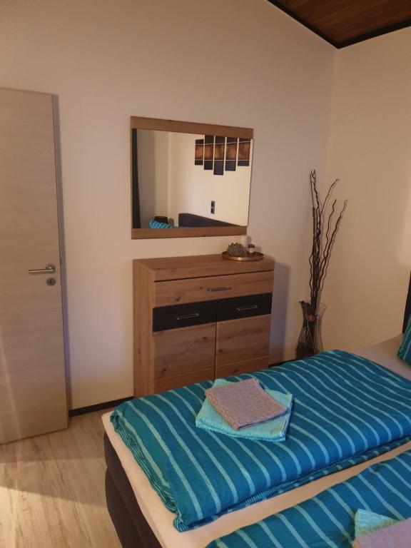 Postel nebo postele na pokoji v ubytování Ferienhaus Bella