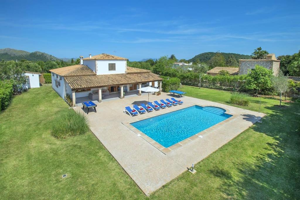 an aerial view of a house with a swimming pool at NEW! Villa Orquidea - walking distance to Pollença village in Pollença