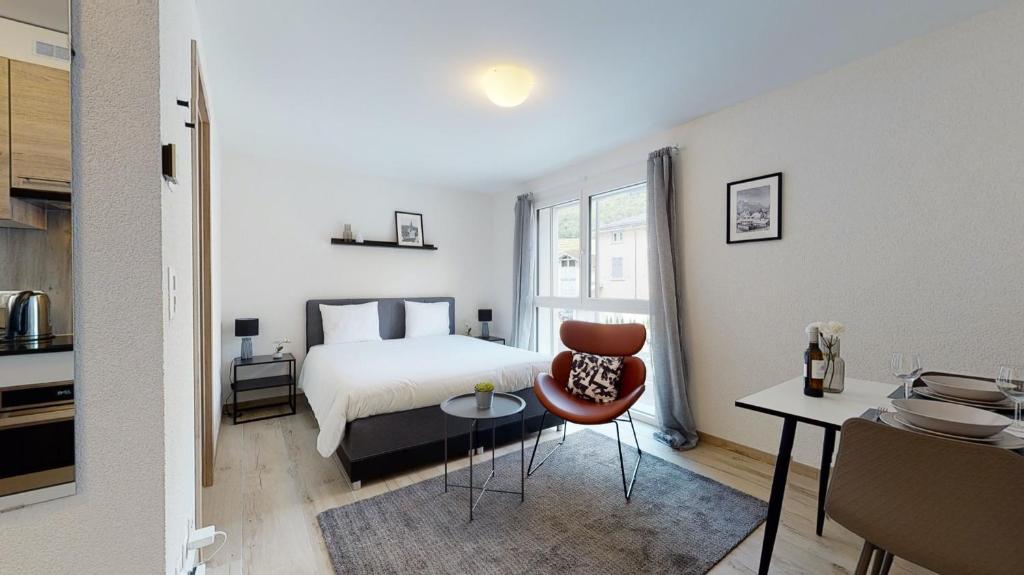 Uma cama ou camas num quarto em Nonanteneuf appart hōtel Aigle - contactless check-in