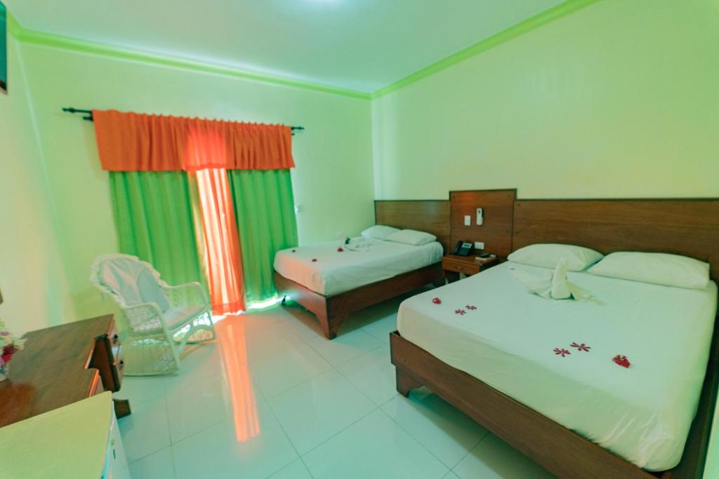 Postel nebo postele na pokoji v ubytování Hotel Yonu
