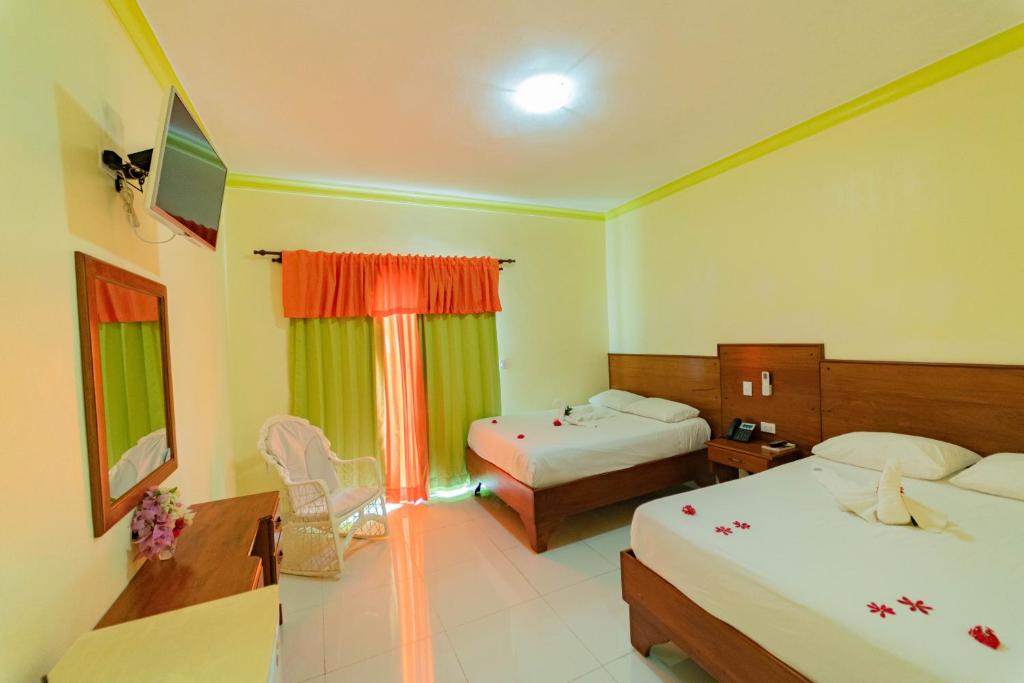 Postel nebo postele na pokoji v ubytování Hotel Yonu