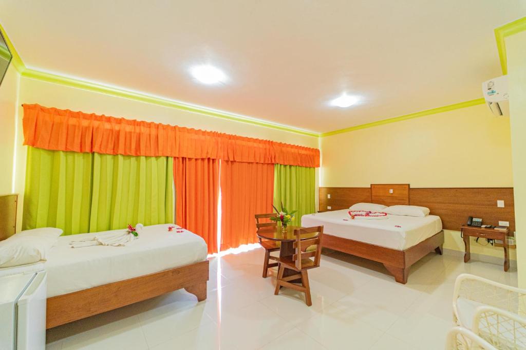 Postel nebo postele na pokoji v ubytování Hotel Yonu