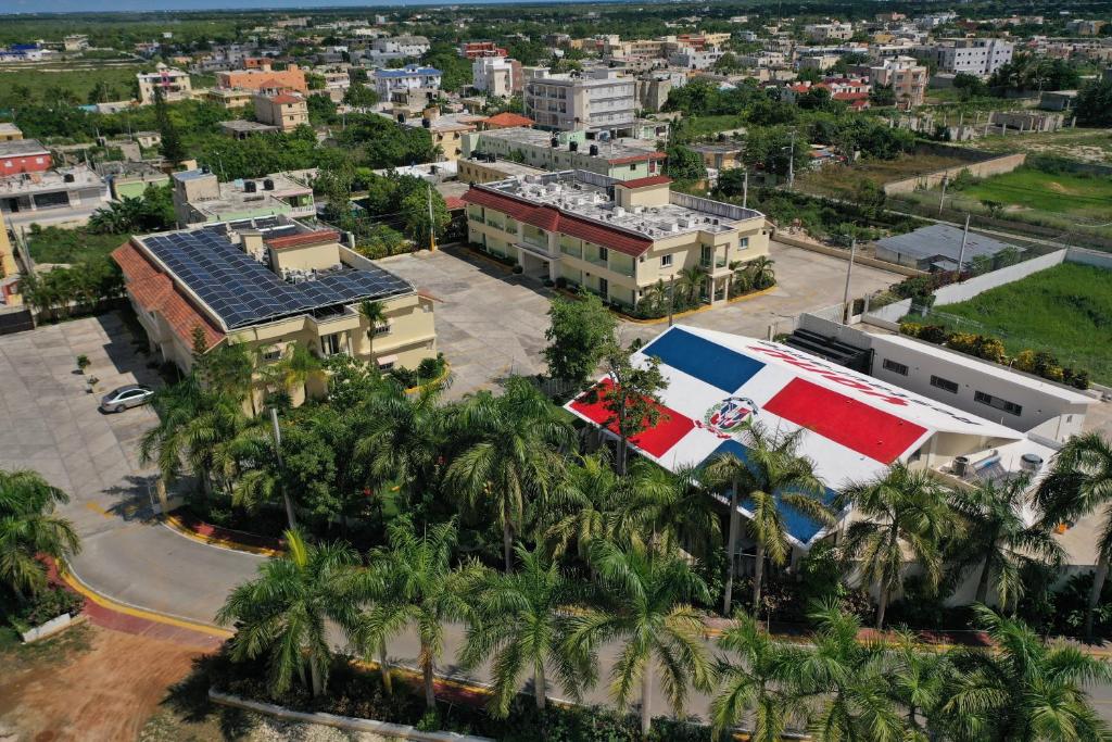 an aerial view of a city with palm trees and buildings at Hotel Yonu in Punta Cana