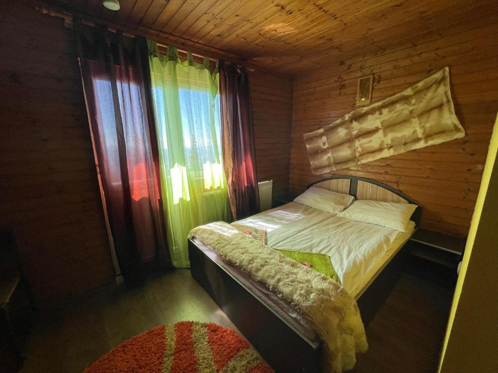 Postel nebo postele na pokoji v ubytování Cabana la Razvan