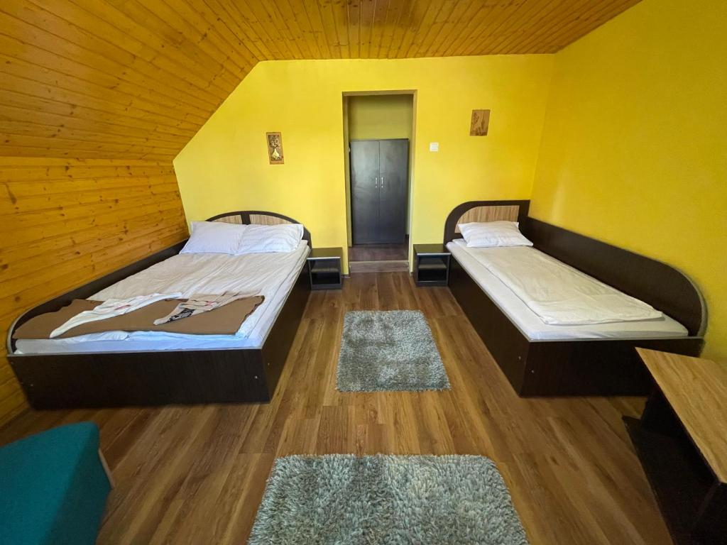 Postel nebo postele na pokoji v ubytování Cabana la Razvan