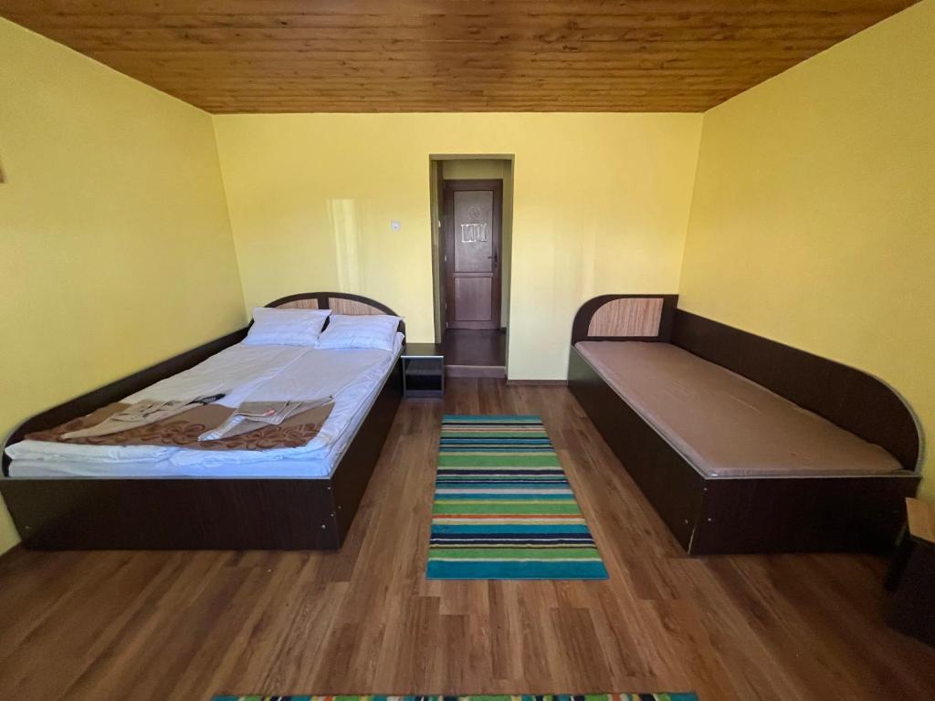 Postel nebo postele na pokoji v ubytování Cabana la Razvan