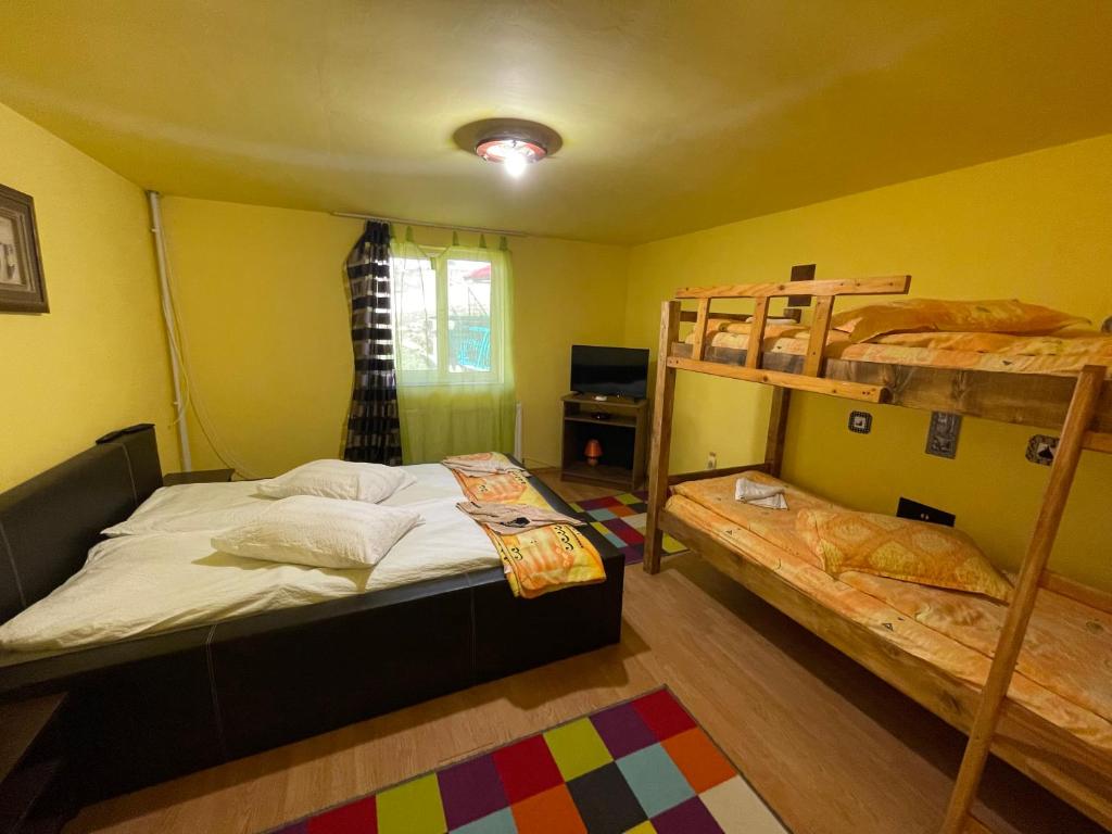 Postel nebo postele na pokoji v ubytování Cabana la Razvan