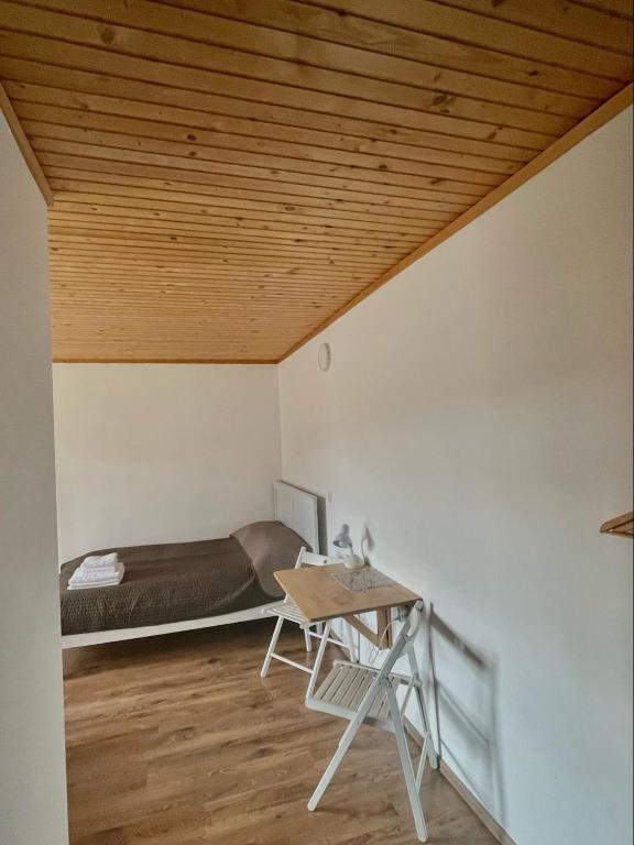 Postel nebo postele na pokoji v ubytování Yaremche House