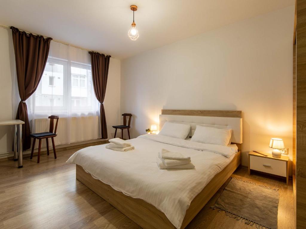 Postel nebo postele na pokoji v ubytování Ionita apartament