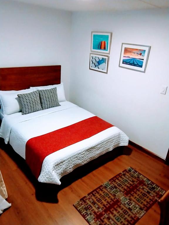 Postel nebo postele na pokoji v ubytování Hotel Maceo Chico