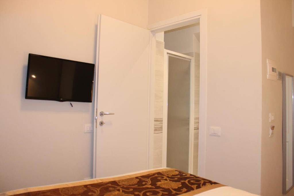 TV a/nebo společenská místnost v ubytování Hotel 900 Toscana