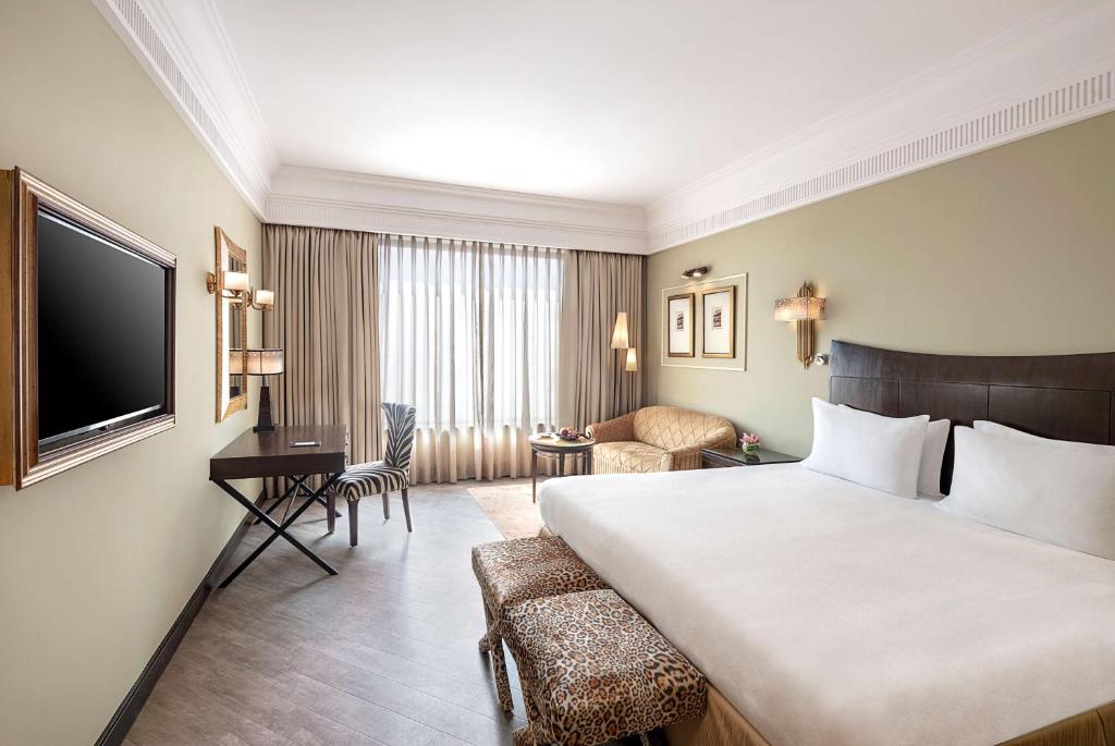 Postel nebo postele na pokoji v ubytování Radisson Blu MBD Hotel Noida