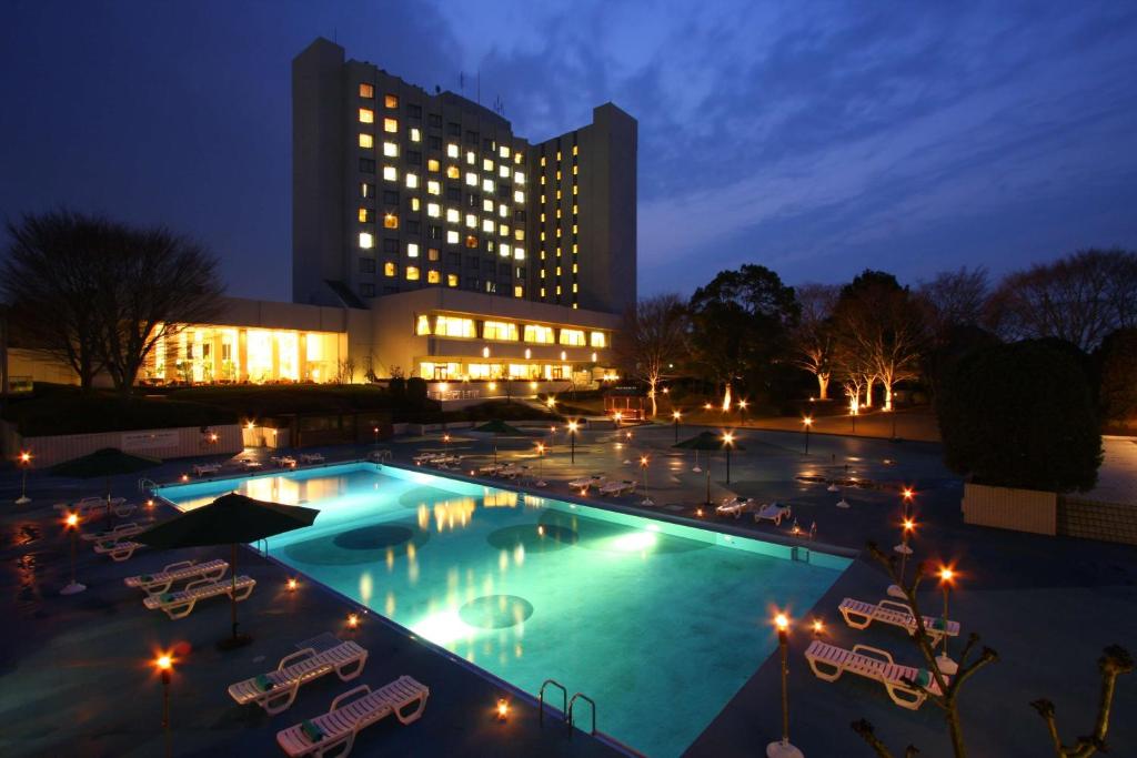 Bazén v ubytování International Resort Hotel Yurakujo nebo v jeho okolí