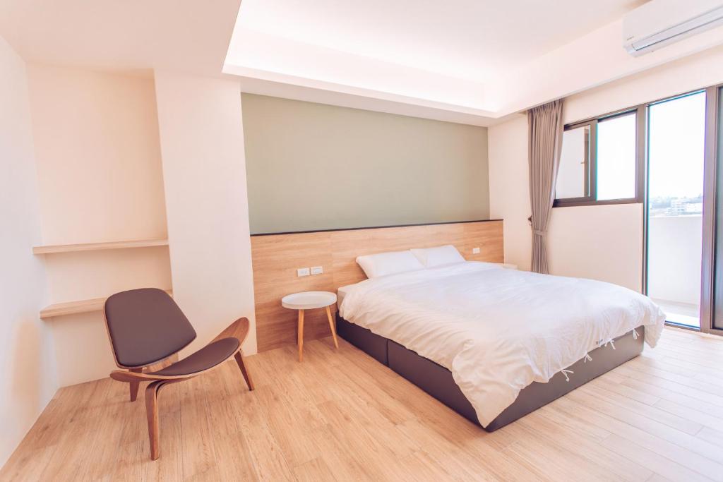 Postel nebo postele na pokoji v ubytování The Pai Hotel