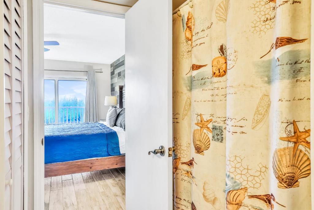 Letto o letti in una camera di Cocoas By The Sea