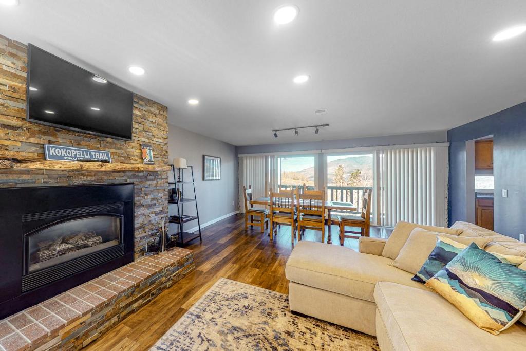a living room with a couch and a fireplace at Wildernest Rest in Silverthorne