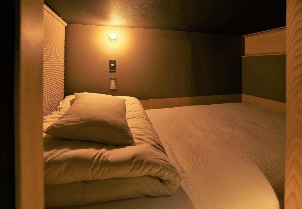Postel nebo postele na pokoji v ubytování AET & o3 HOTEL