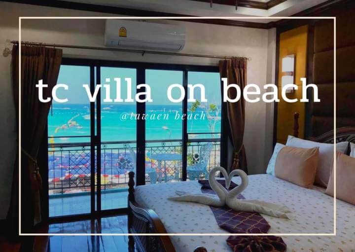 una foto di un letto con un cuore sopra di TC villa on beach a Ko Larn