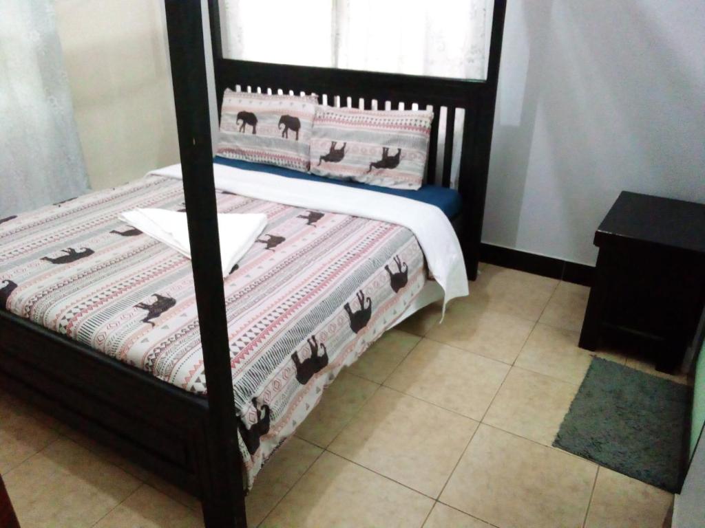 Postelja oz. postelje v sobi nastanitve Lushoto Pazuri