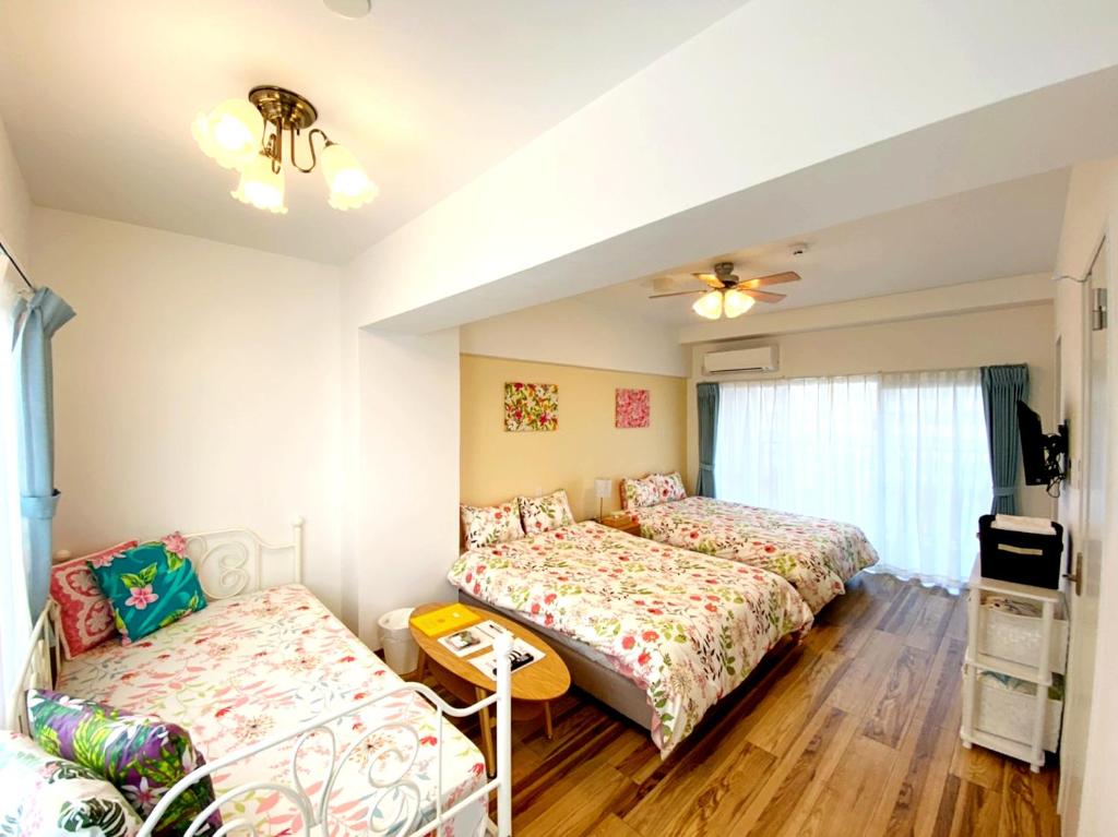 Postel nebo postele na pokoji v ubytování HOTEL HOUKLEA