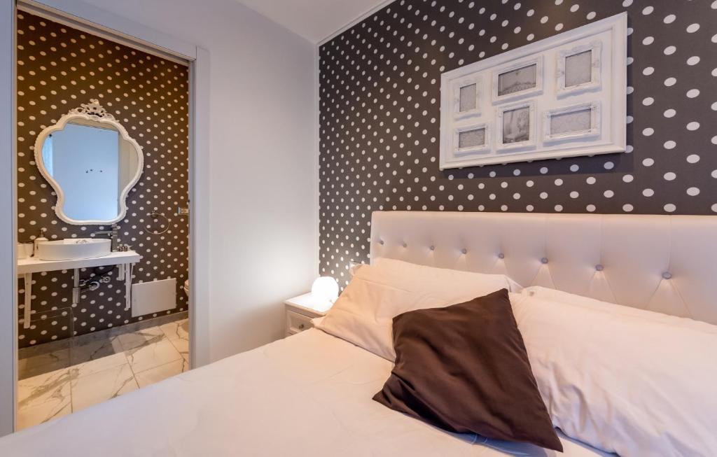 Postel nebo postele na pokoji v ubytování ORA BLU Guest house