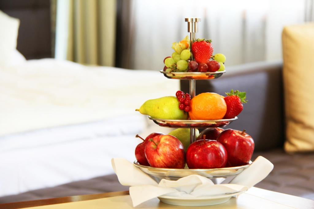 a three tiered fruit display on a table at Hotel St.Gotthard in Zürich