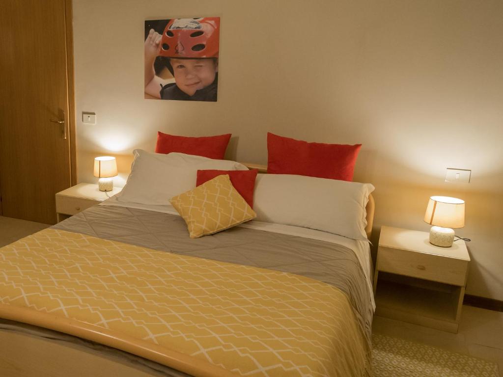 Postel nebo postele na pokoji v ubytování Rafting Hotel Ai Cavallini