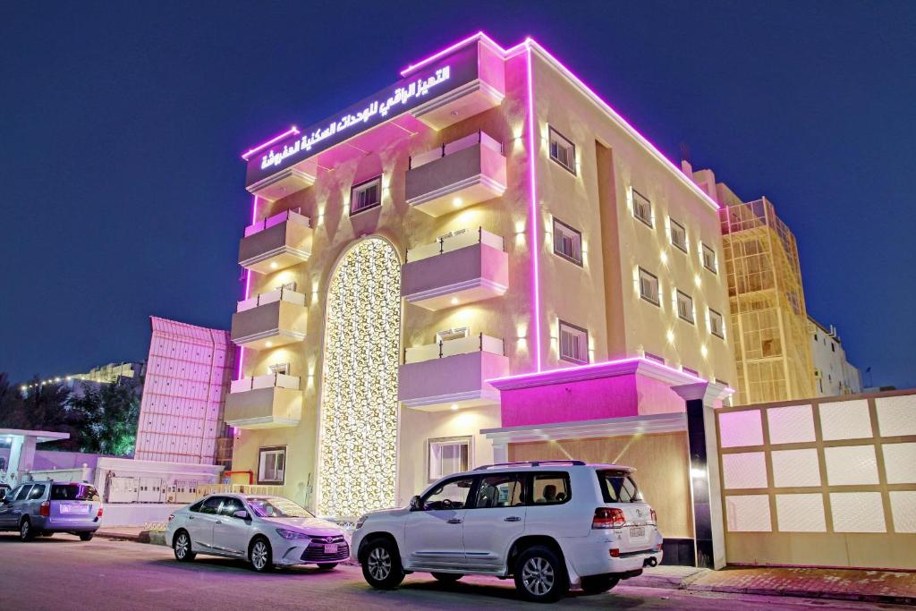 a building with cars parked in front of it at Al Tamayoz Al Raqi - Bani Malik in Jeddah