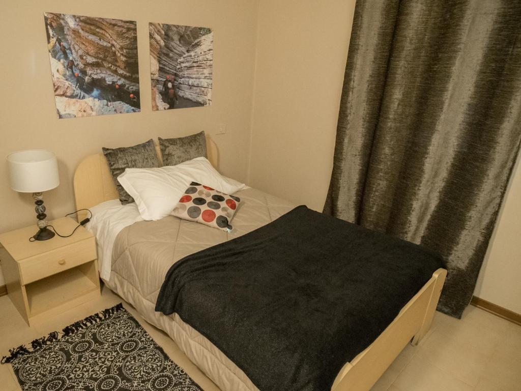 Postel nebo postele na pokoji v ubytování Rafting Hotel Ai Cavallini