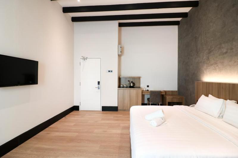 Postel nebo postele na pokoji v ubytování The NINES HOTEL Malacca