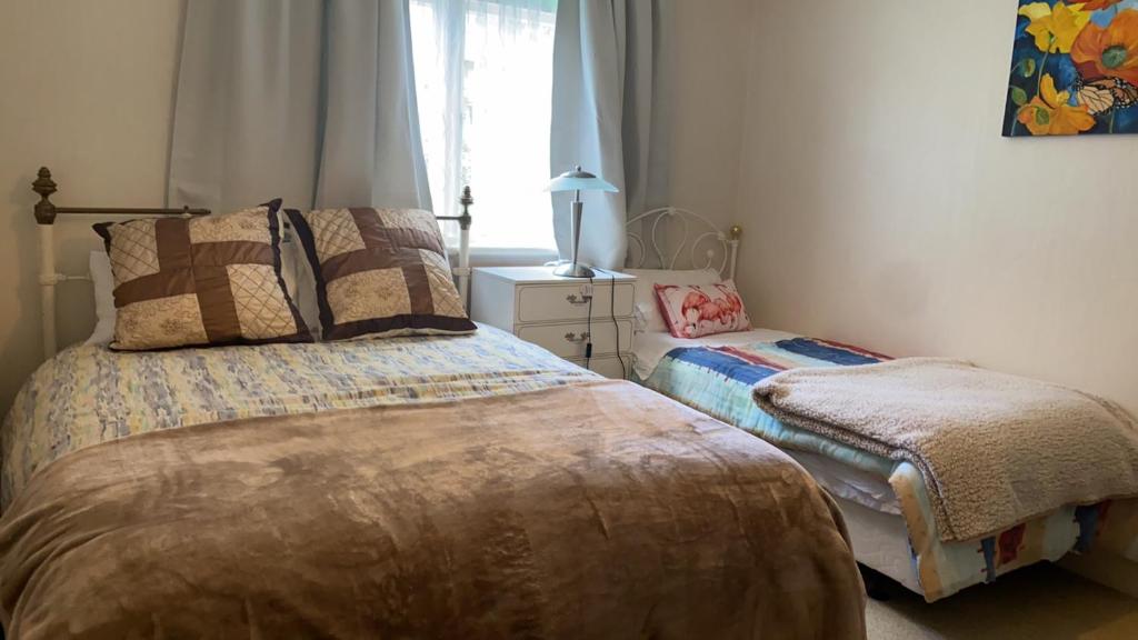 Postel nebo postele na pokoji v ubytování Green garden home