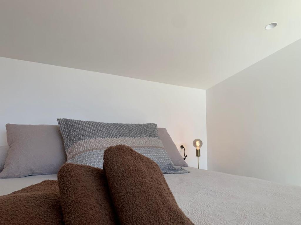 A bed or beds in a room at Ca La Fustereta