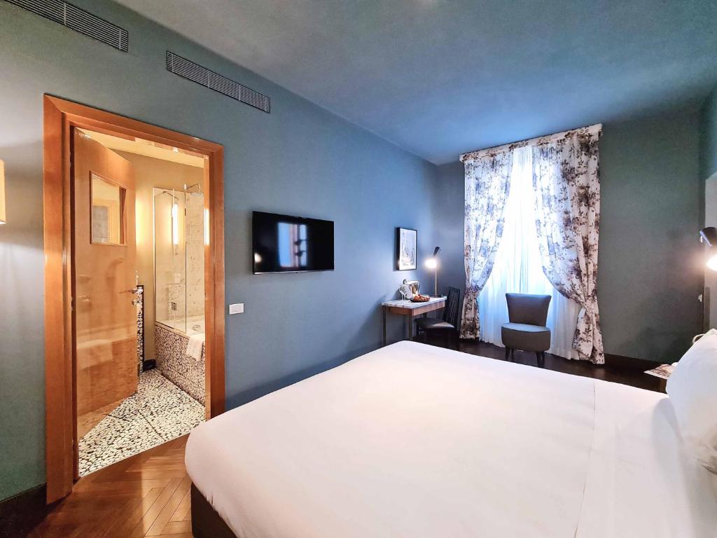 Postel nebo postele na pokoji v ubytování Hotel Garibaldi Blu - WTB Hotels