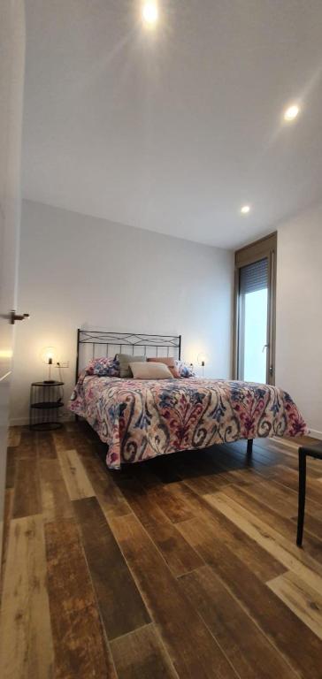 A bed or beds in a room at Ca La Fustereta