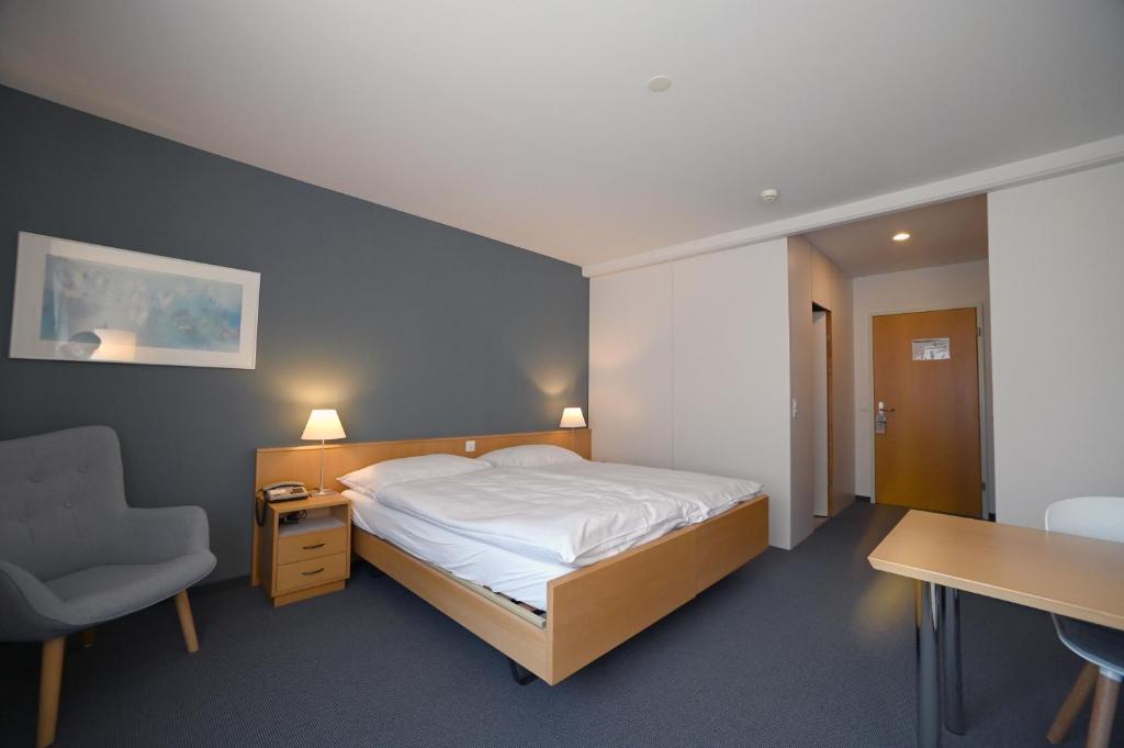 Postel nebo postele na pokoji v ubytování Hotel Ländli