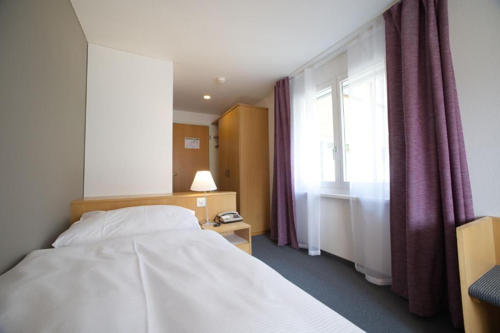 Postel nebo postele na pokoji v ubytování Hotel Ländli