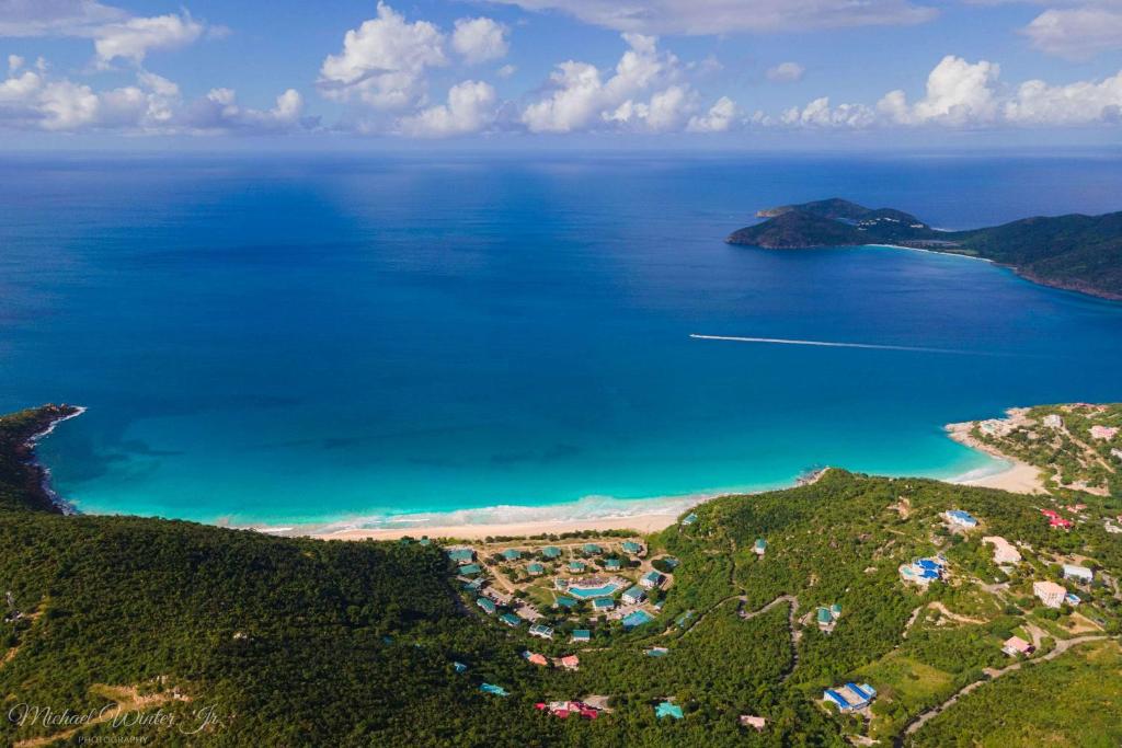 an aerial view of a beach and the ocean at Wyndham Tortola BVI Lambert Beach Resort in East End