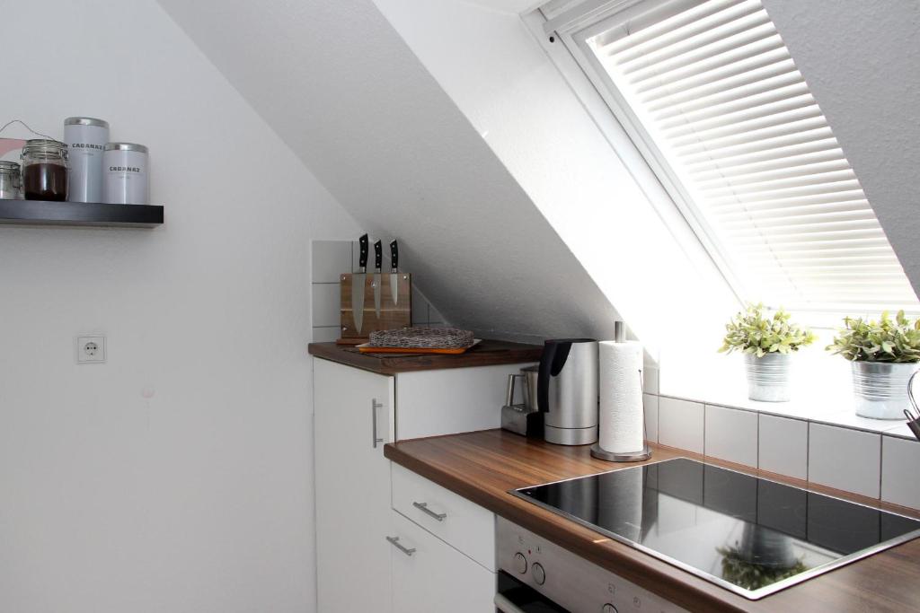 Kuchyň nebo kuchyňský kout v ubytování Ferienwohnung Seeloft mit Balkon und Seeblick
