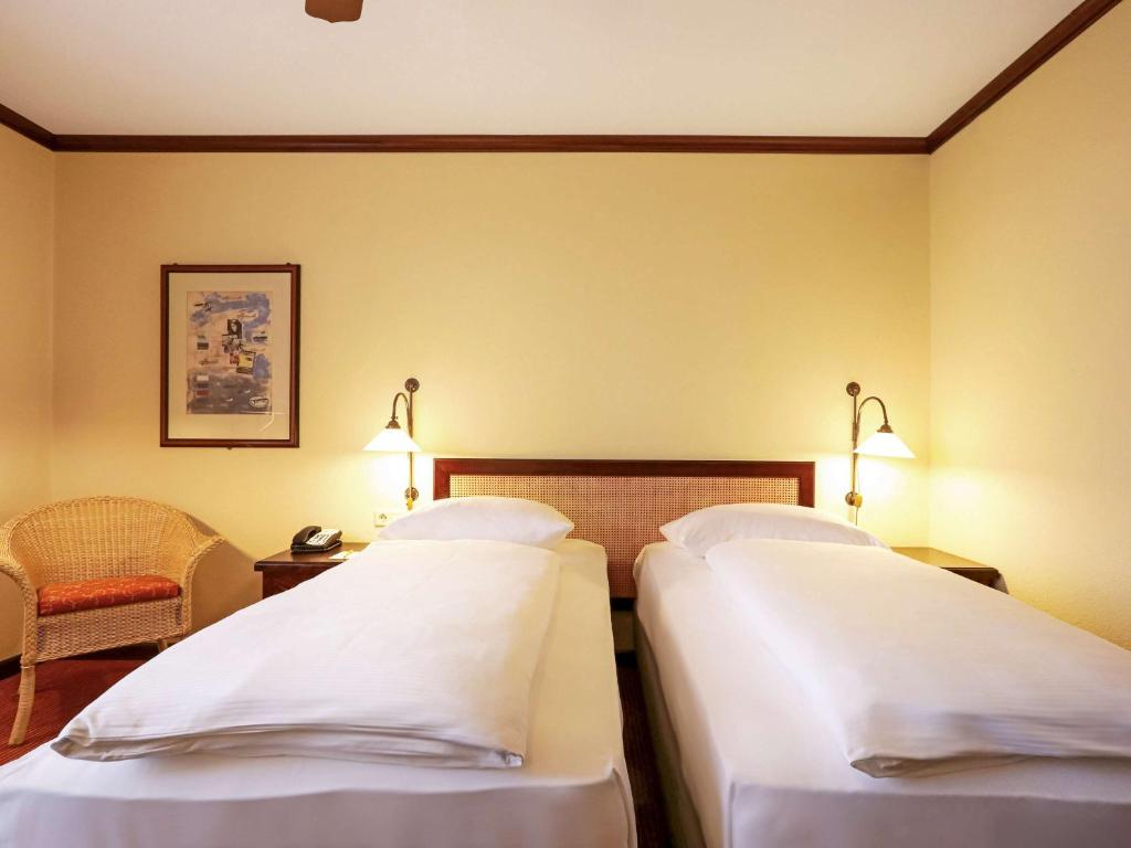 Postel nebo postele na pokoji v ubytování Mercure Hotel Frankfurt Airport Langen