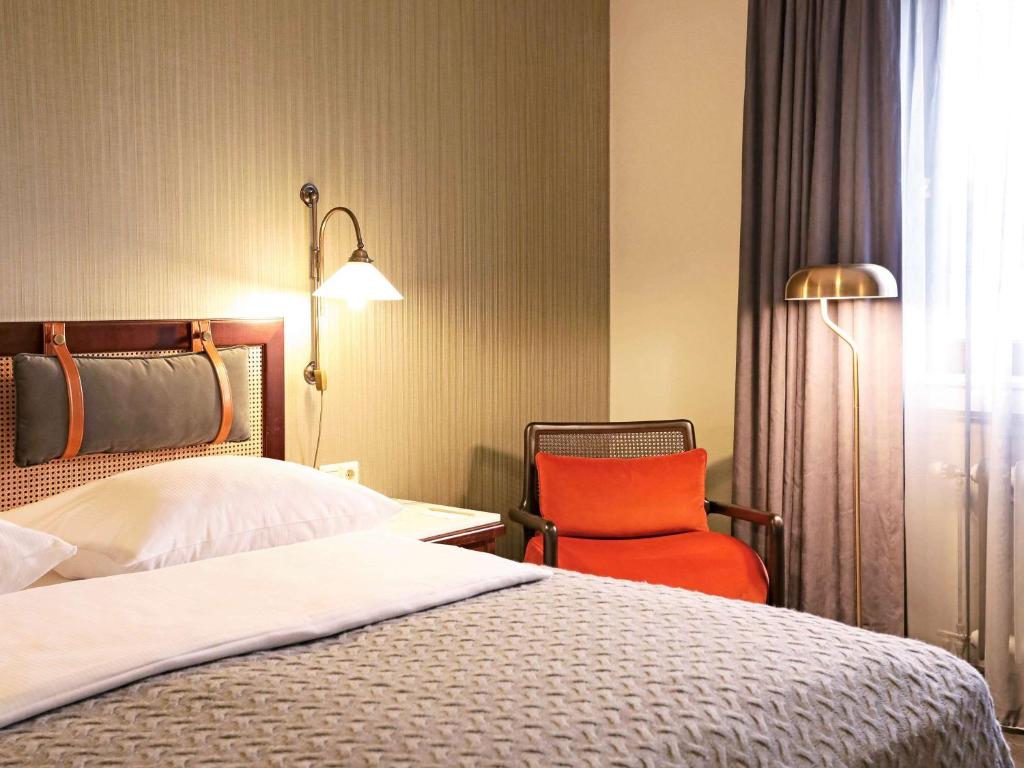 Postel nebo postele na pokoji v ubytování Mercure Hotel Frankfurt Airport Langen